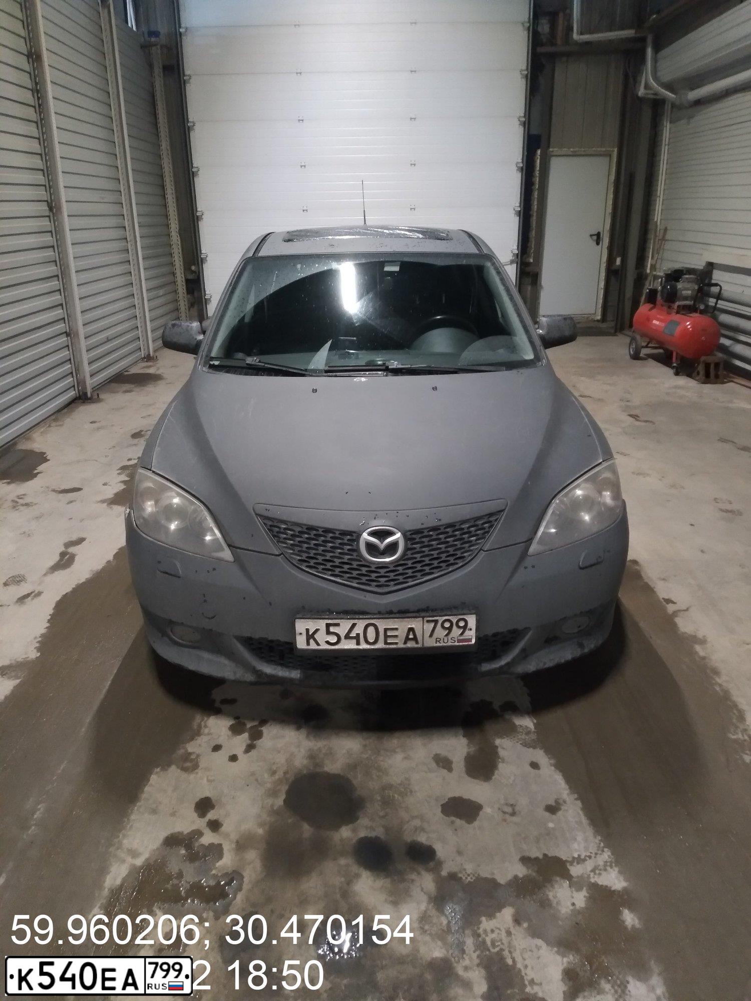 Фото автомобиля MAZDA 3, 2005 — госномер Т992МА198. Цвет: СЕРО-ЗОЛОТИСТЫЙ