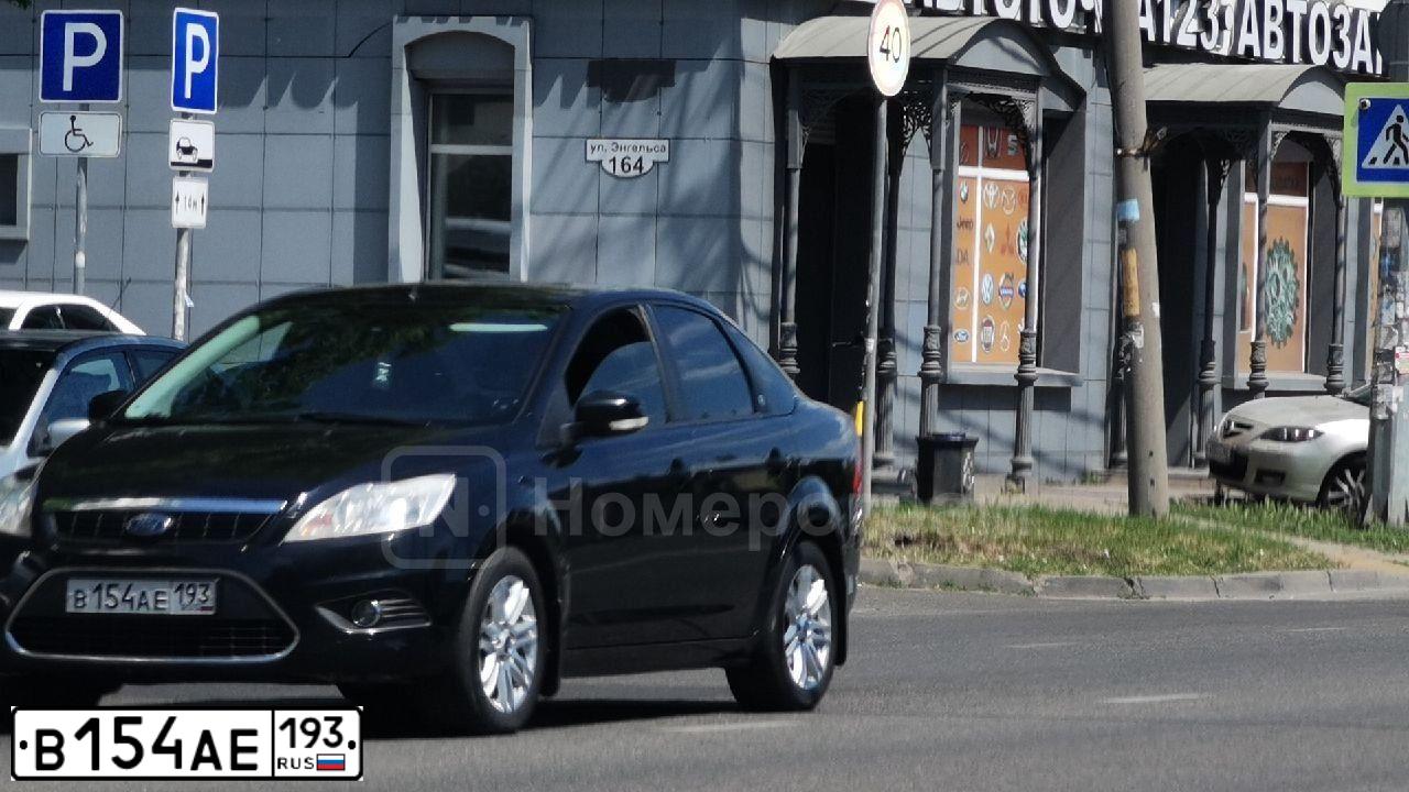 Фото автомобиля FORD FOCUS, 2008 — госномер В154АЕ193. Цвет: ЧЕРНЫЙ