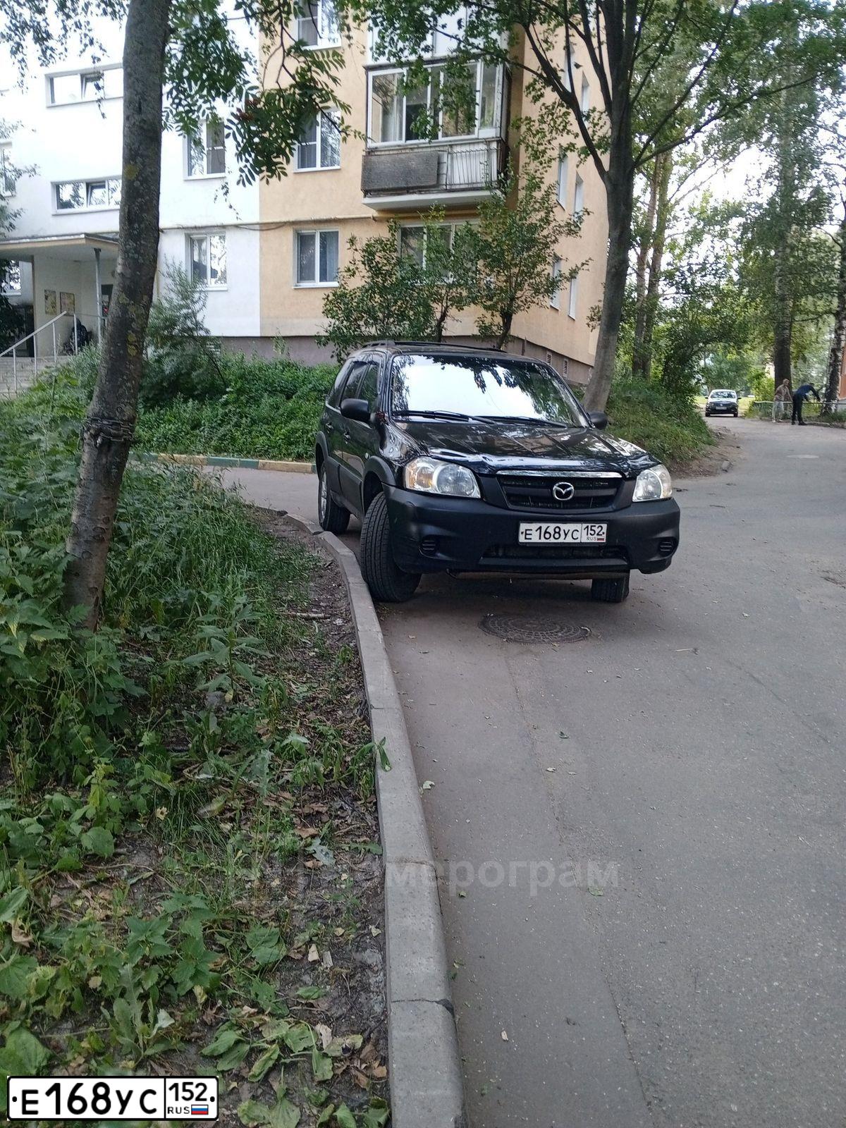 Фото автомобиля MAZDA TRIBUTE, 2005 — госномер Е168УС152. Цвет: ЧЕРНЫЙ