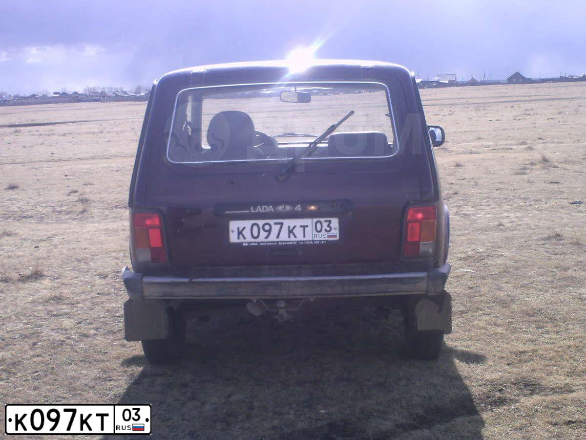 Фото автомобиля LADA 2121 NIVA, 2012 — госномер К097КТ03. Цвет: ТЕМНО-ВИШНЕВЫЙ