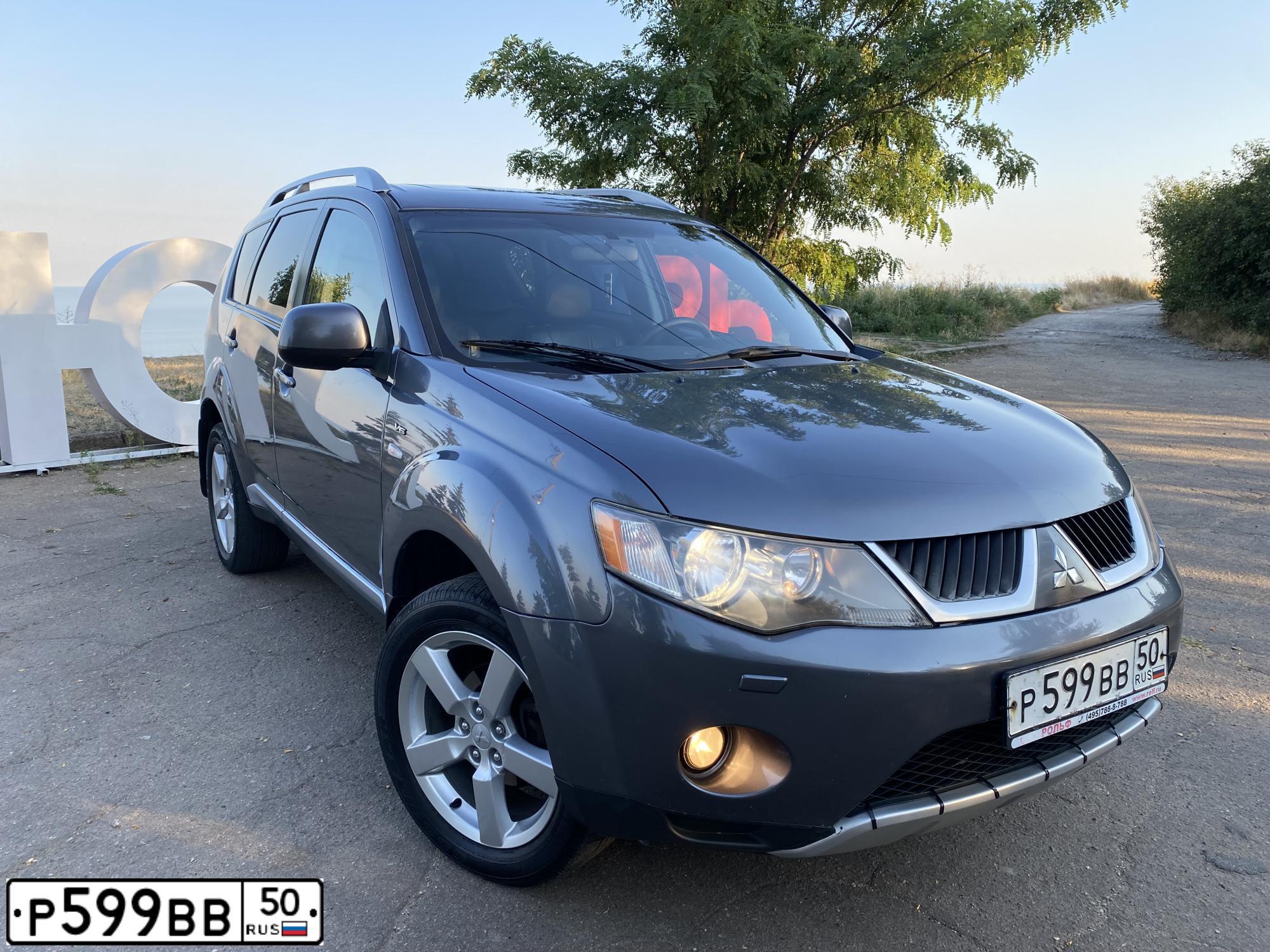 Фото автомобиля MITSUBISHI  АУТЛЕНДЕР, 2007 — госномер Р150АМ180. Цвет: Серый