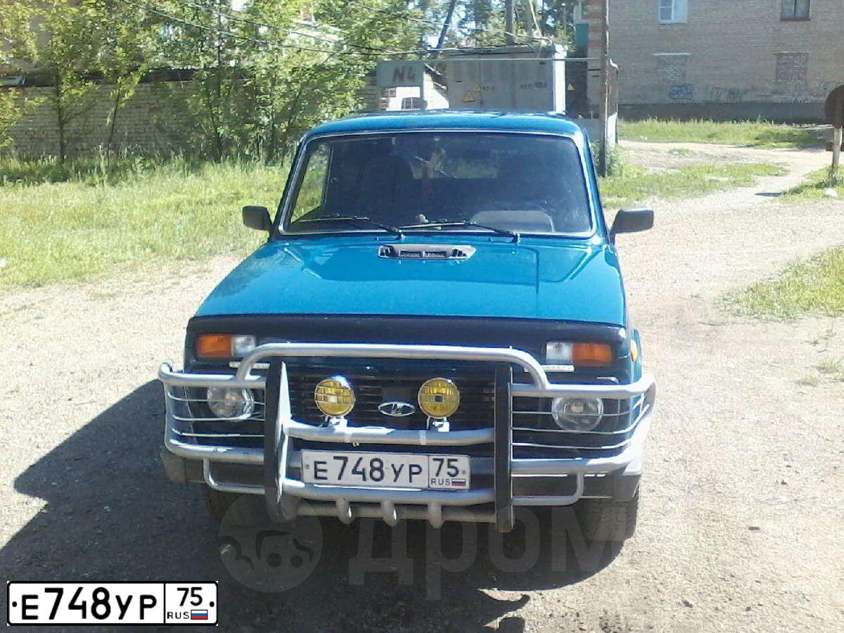 Фото автомобиля LADA 2121 NIVA, 2010 — госномер Е748УР75. Цвет: Сине-зеленый
