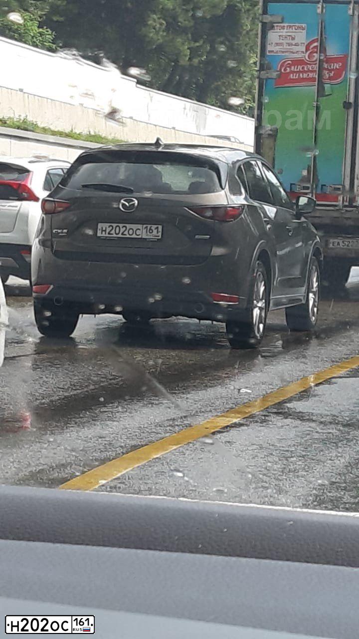Фото автомобиля MAZDA 3, 2012 — госномер Н202ОС161. Цвет: ЧЕРНЫЙ
