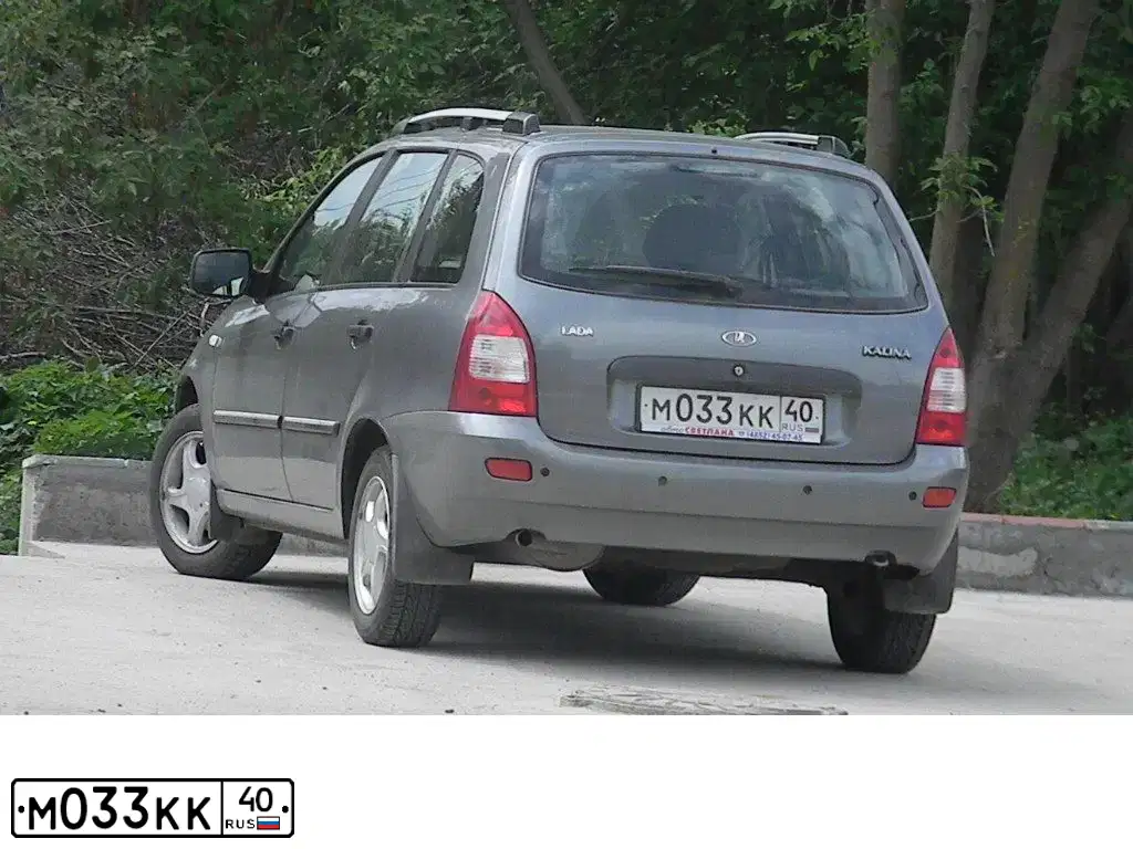 Фото автомобиля LADA 1117 KALINA, 2010 — госномер М033КК40. Цвет: ТЕМНО-СЕРЫЙ