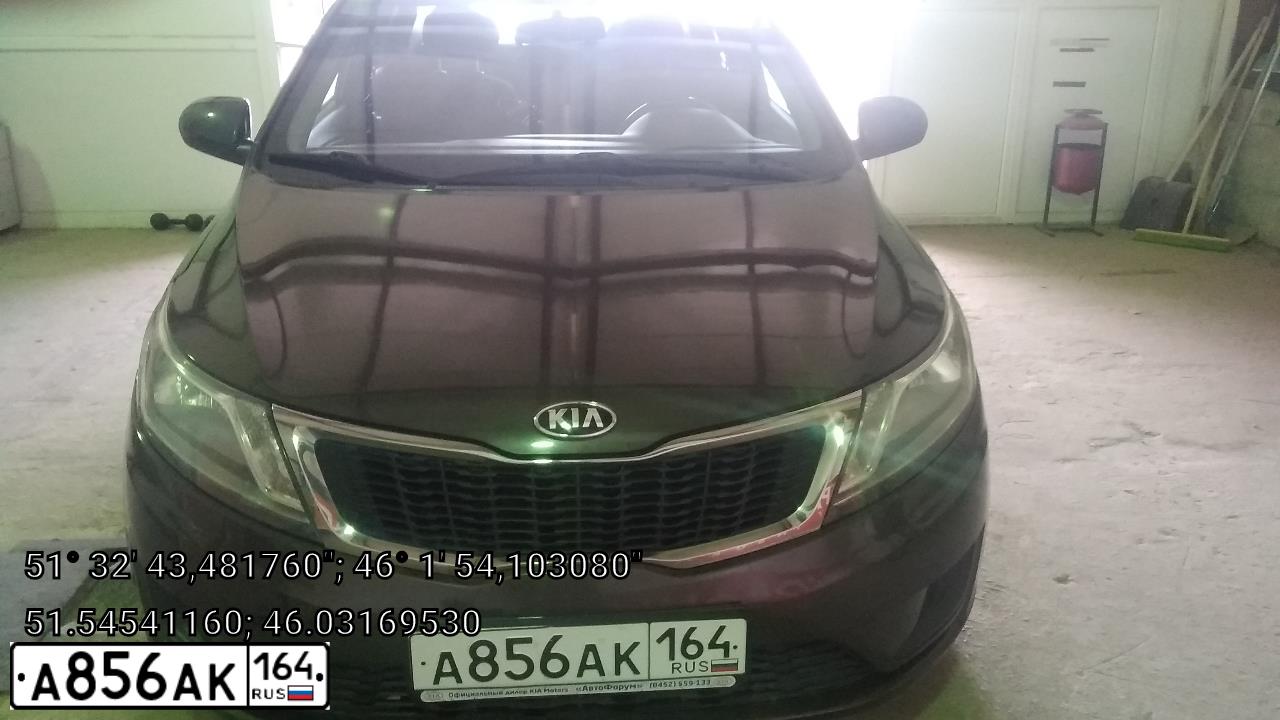 Фото автомобиля KIA RIO, 2014 — госномер А856АК164. Цвет: Коричневый
