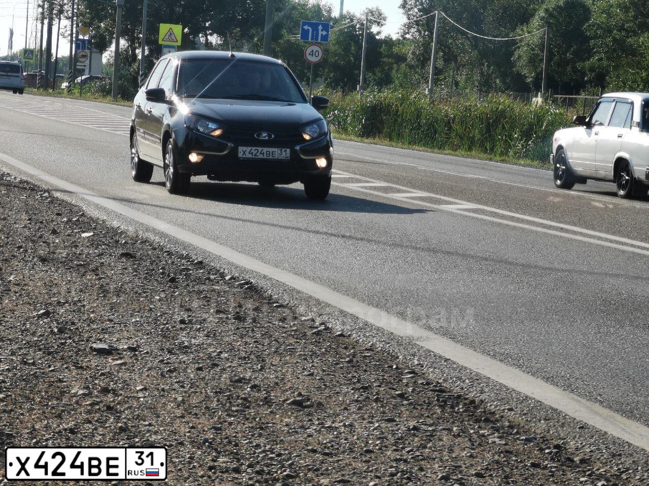 Фото автомобиля LADA GRANTA, 2022 — госномер Х908РЕ31. Цвет: ЧЕРНЫЙ