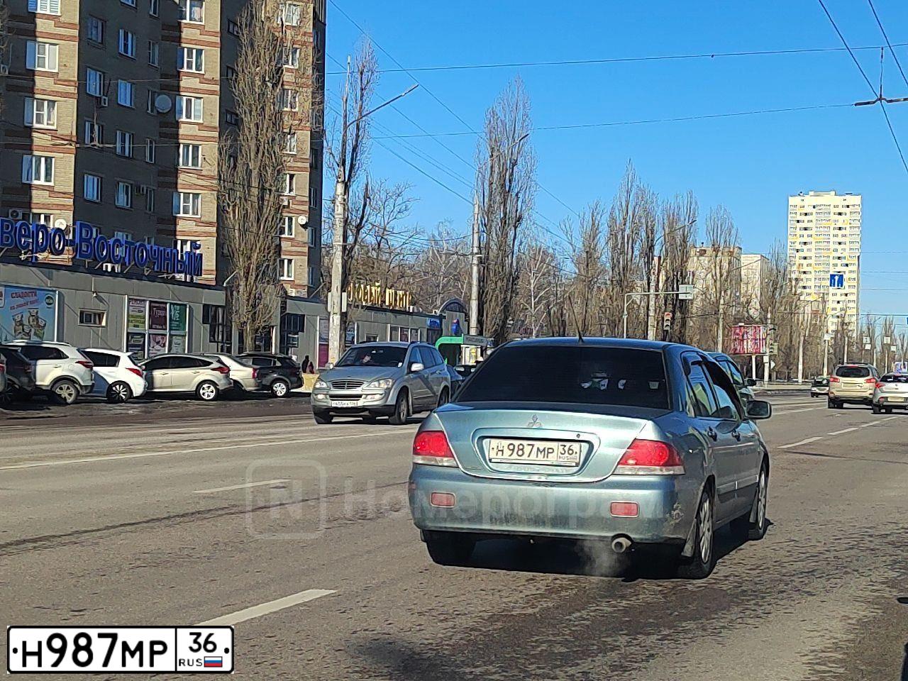 Фото автомобиля MITSUBISHI LANCER, 2006 — госномер Н987МР36. Цвет: СВЕТЛО-СЕРО-ЗЕЛЕНЫЙ
