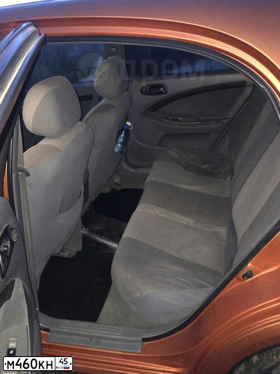 Фото автомобиля CHEVROLET LACETTI, 2006 — госномер Т002КТ72. Цвет: ОРАНЖЕВЫЙ