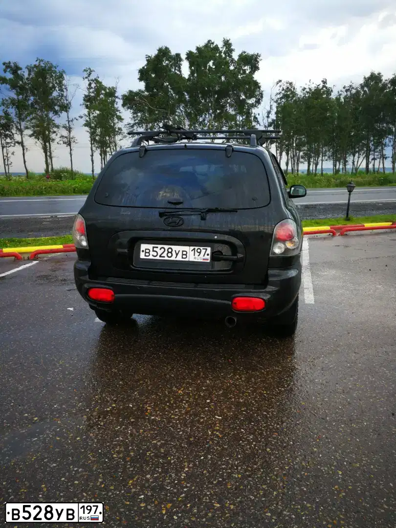 Фото автомобиля HYUNDAI SANTA FE, 2003 — госномер В528УВ197. Цвет: ЧЕРНЫЙ