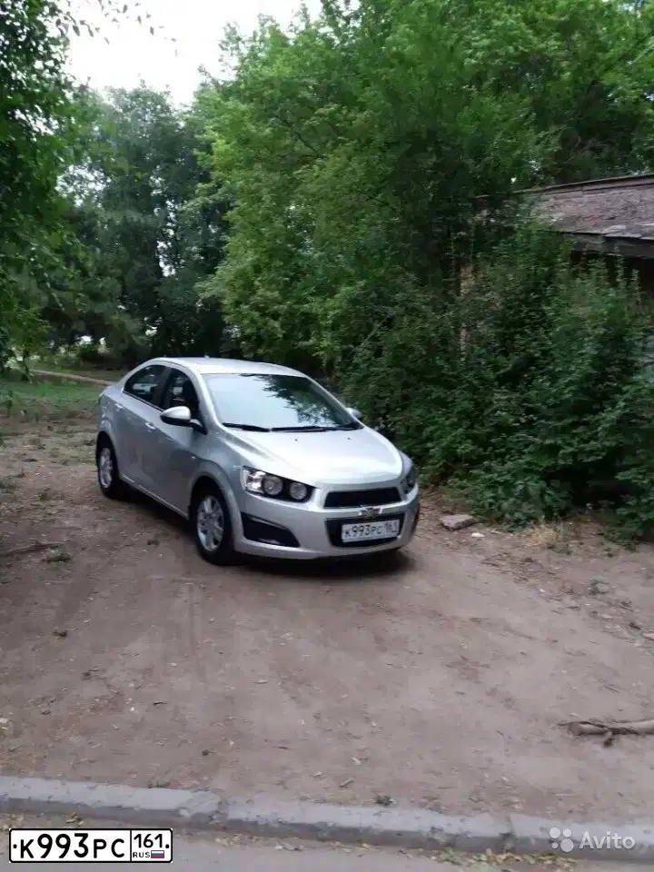 Фото автомобиля CHEVROLET AVEO, 2012 — госномер К993РС161. Цвет: серебристый