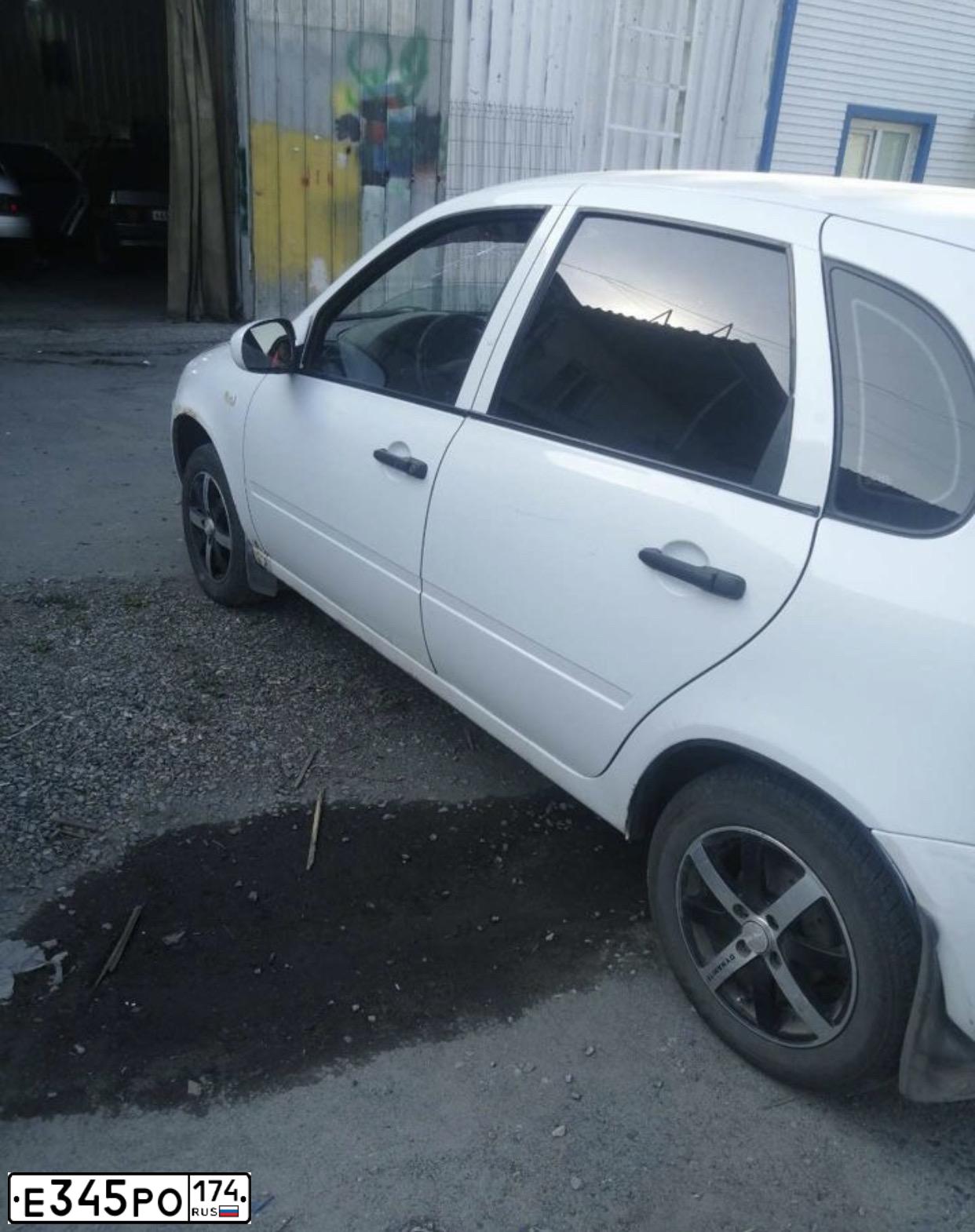 Фото автомобиля LADA 1119 KALINA, 2009 — госномер Е345РО174. Цвет: Белый