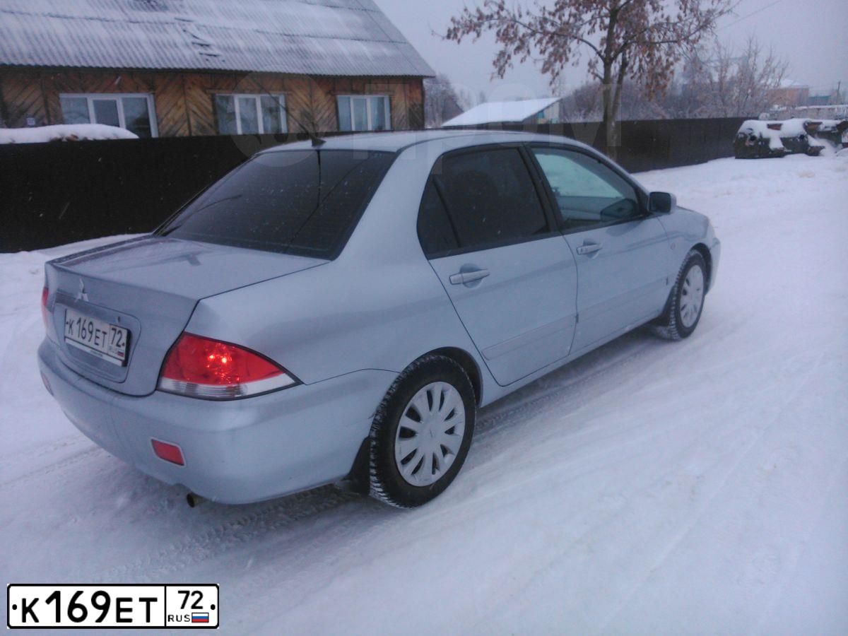 Фото автомобиля MITSUBISHI LANCER, 2007 — госномер Р009РС72. Цвет: серебристый