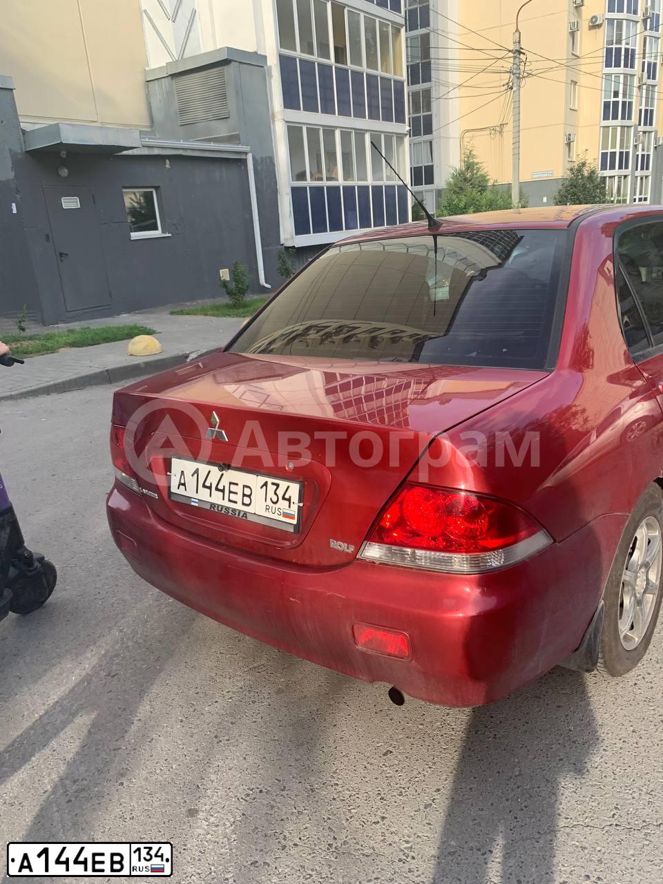 Фото автомобиля MITSUBISHI LANCER, 2005 — госномер А144ЕВ134. Цвет: Красный