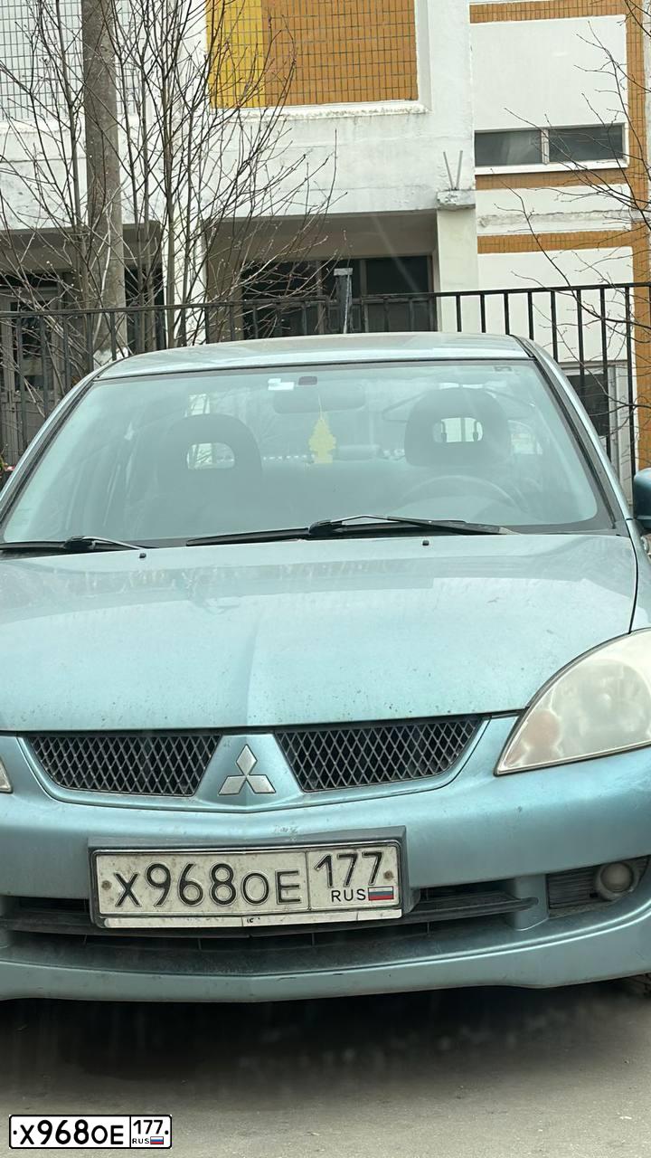 Фото автомобиля MITSUBISHI LANCER, 2006 — госномер Х968ОЕ177. Цвет: СЕРО-ЗЕЛЕНЫЙ