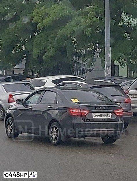 Фото автомобиля LADA VESTA, 2017 — госномер О448НР31. Цвет: ЧЕРНЫЙ