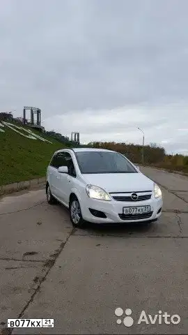 Фото автомобиля OPEL ZAFIRA, 2011 — госномер В077КХ21. Цвет: БЕЛЫЙ
