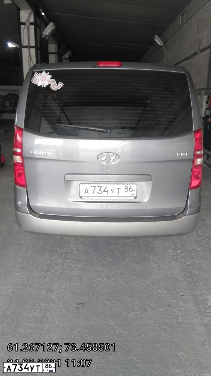 Фото автомобиля HYUNDAI H 1/H 100/STAREX, 2010 — госномер А734УТ86. Цвет: ТЕМНО-СЕРЫЙ