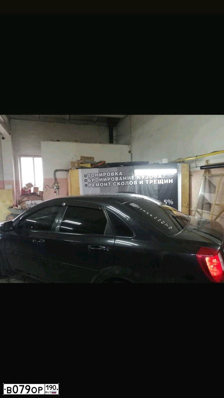 Фото автомобиля CHEVROLET LACETTI, 2011 — госномер К023ТХ21. Цвет: ЧЕРНЫЙ