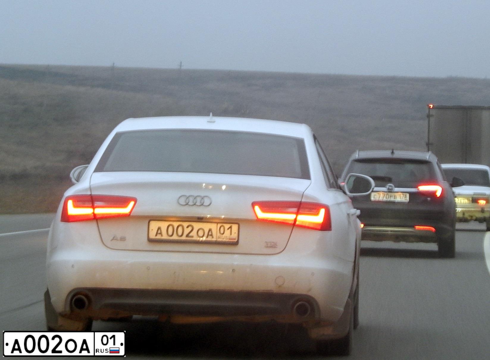 Фото автомобиля AUDI A6, 2011 — госномер А002ОА01. Цвет: Белый