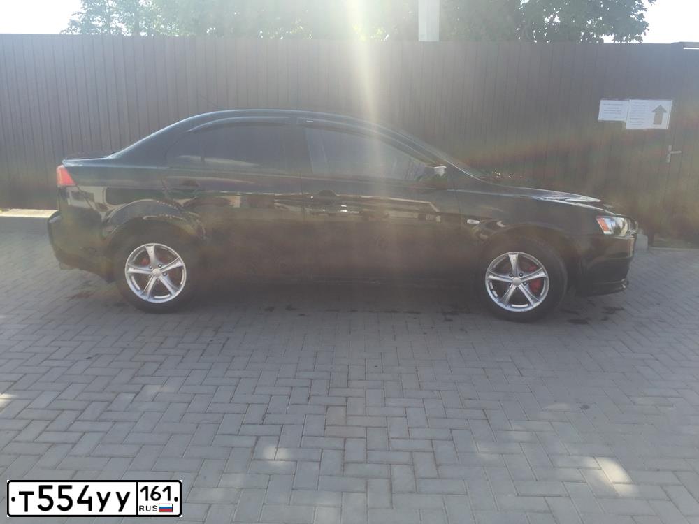 Фото автомобиля MITSUBISHI LANCER, 2008 — госномер К055СМ95. Цвет: ЧЕРНЫЙ