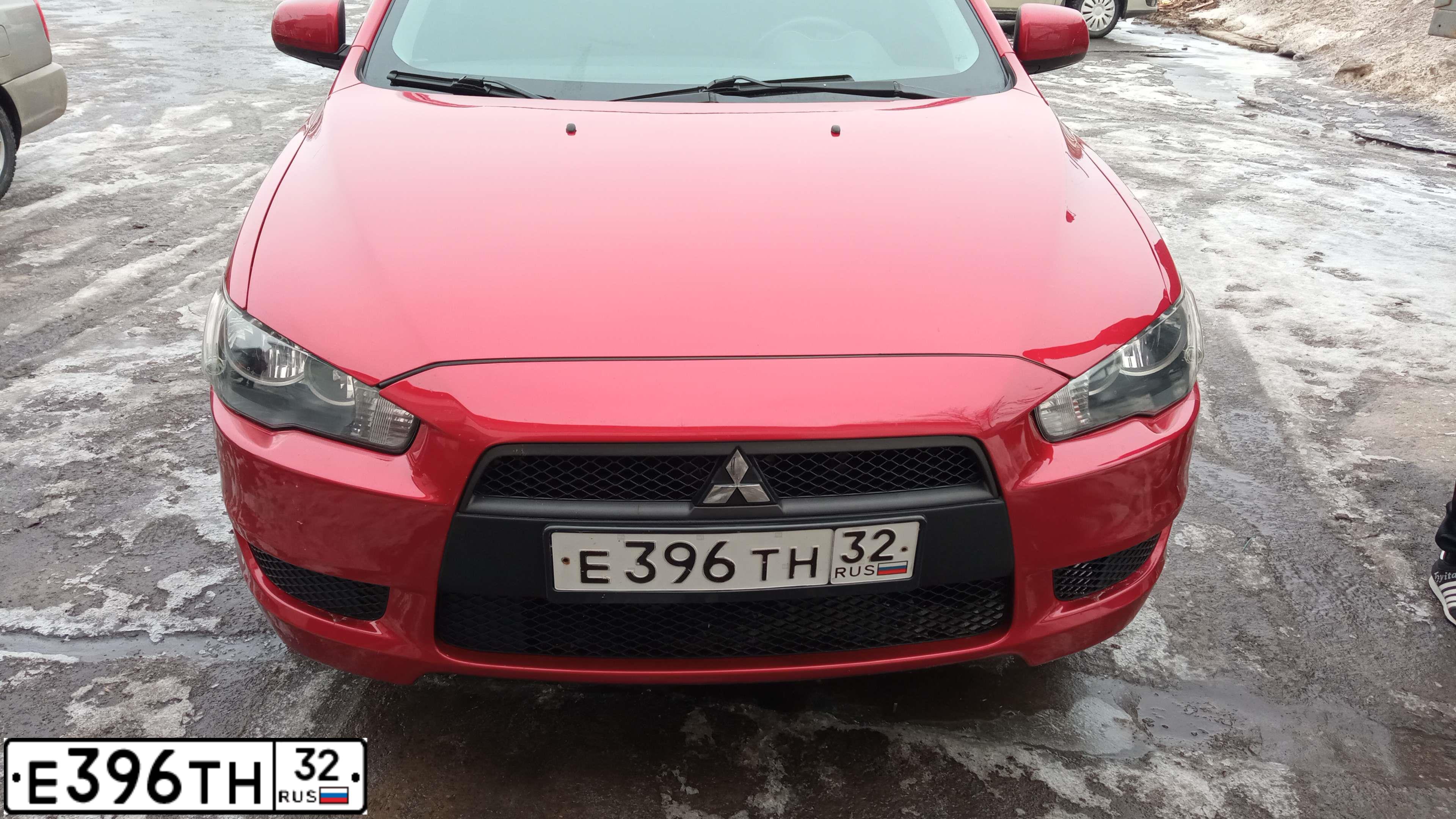 Фото автомобиля MITSUBISHI LANCER, 2007 — госномер Е396ТН32. Цвет: Красный