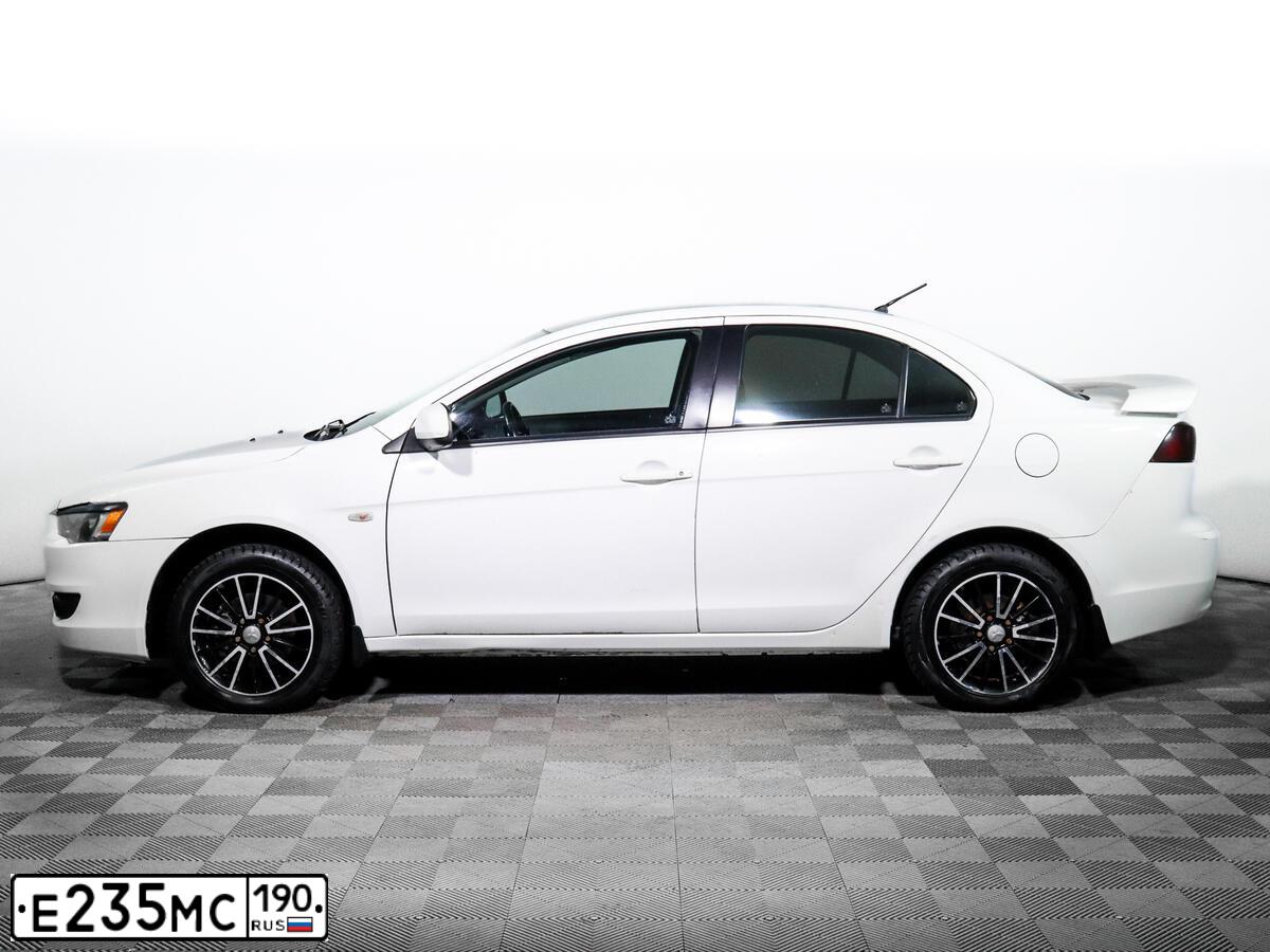 Фото автомобиля MITSUBISHI LANCER, 2008 — госномер А930ХЕ33. Цвет: Белый