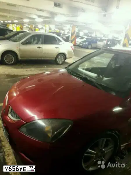Фото автомобиля MITSUBISHI LANCER, 2004 — госномер Р235РТ97. Цвет: Красный