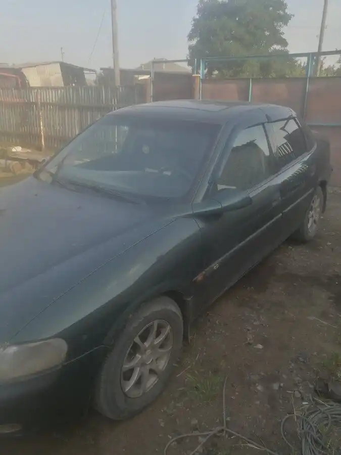 Фото автомобиля LADA 2109 SAMARA, 2003 — госномер К212ОЕ40. Цвет: ЯРКО-СИНИЙ