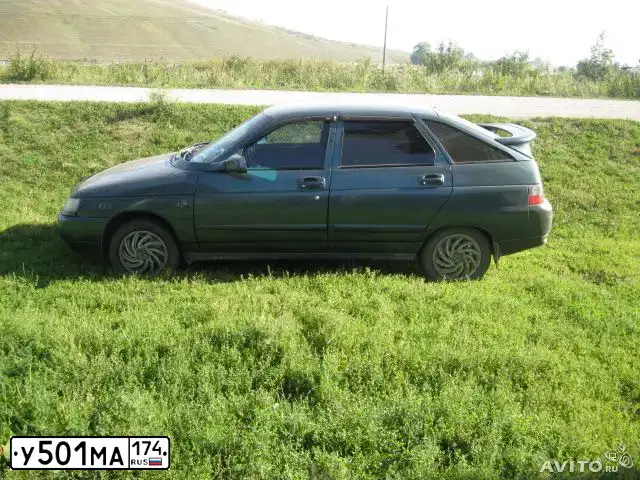 Фото автомобиля LADA 2112, 2006 — госномер Р430КМ774. Цвет: СЕРО-СИНЕ-ЗЕЛЕНЫЙ