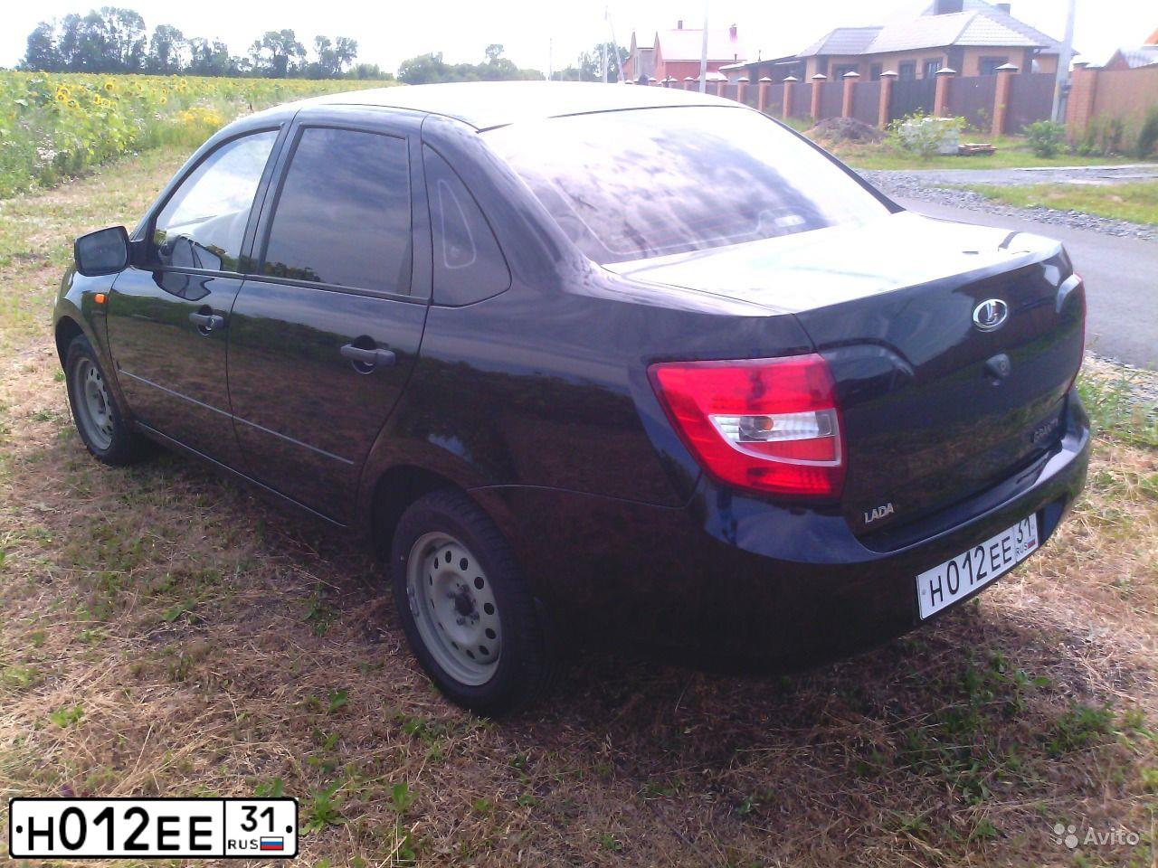 Фото автомобиля LADA 2190 GRANTA, 2012 — госномер Р404ТК31. Цвет: СИНЕ-ЧЕРНЫЙ