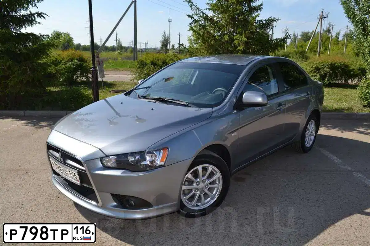 Фото автомобиля MITSUBISHI LANCER, 2012 — госномер К269НЕ702. Цвет: СЕРЫЙ