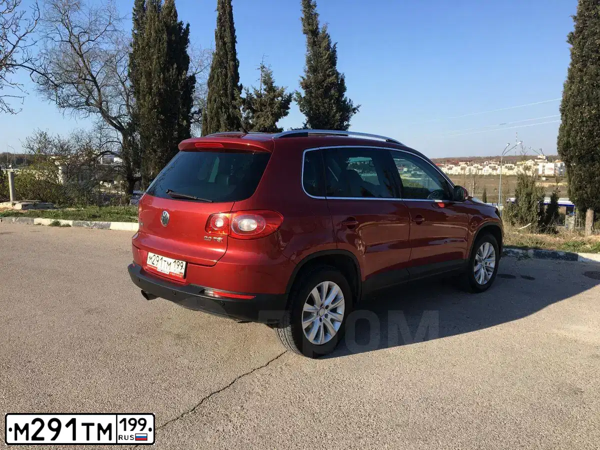 Фото автомобиля VOLKSWAGEN TIGUAN, 2009 — госномер В179КВ92. Цвет: КРАСНЫЙ