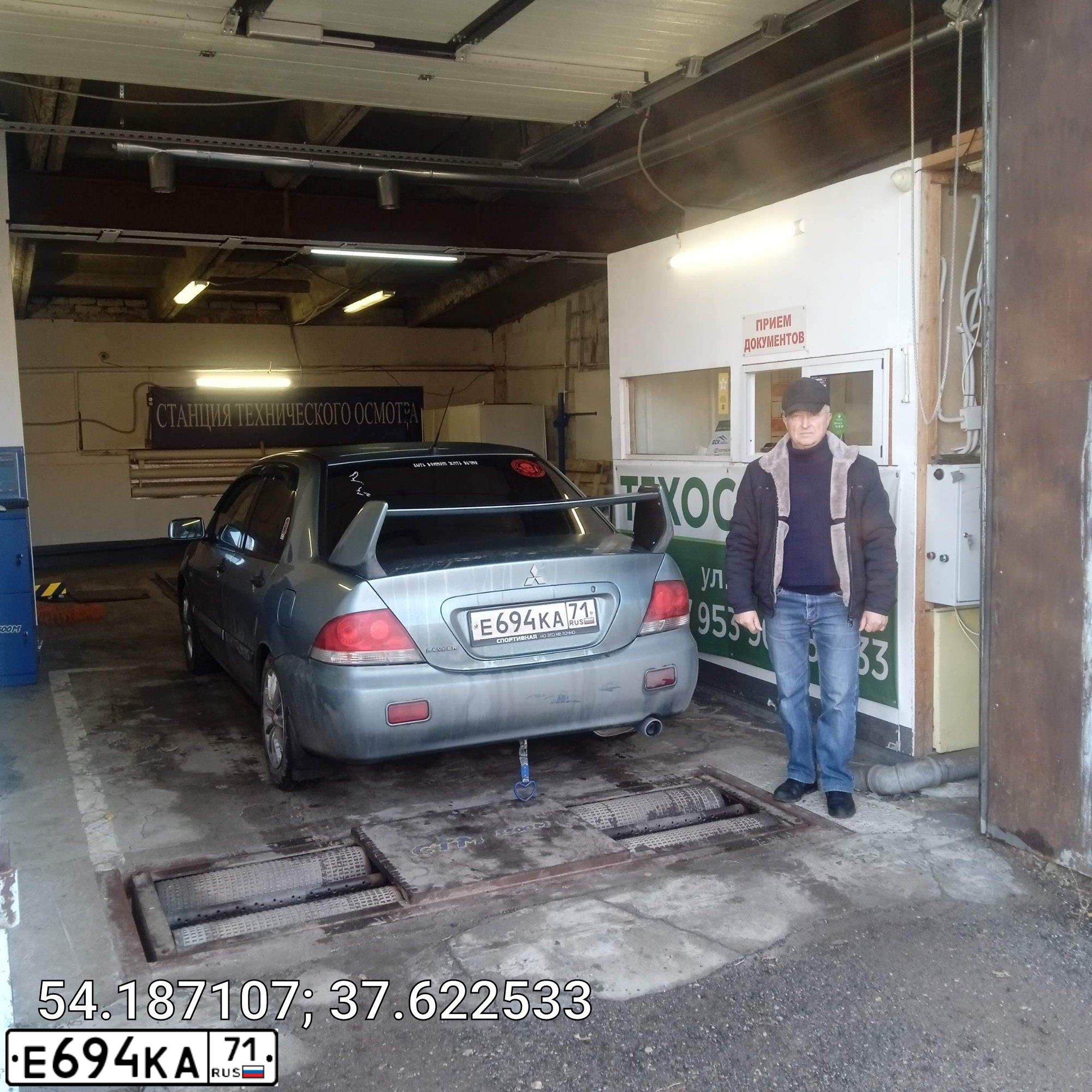 Фото автомобиля MITSUBISHI LANCER, 2006 — госномер Е694КА71. Цвет: СВЕТЛО-СЕРО-ЗЕЛЕНЫЙ