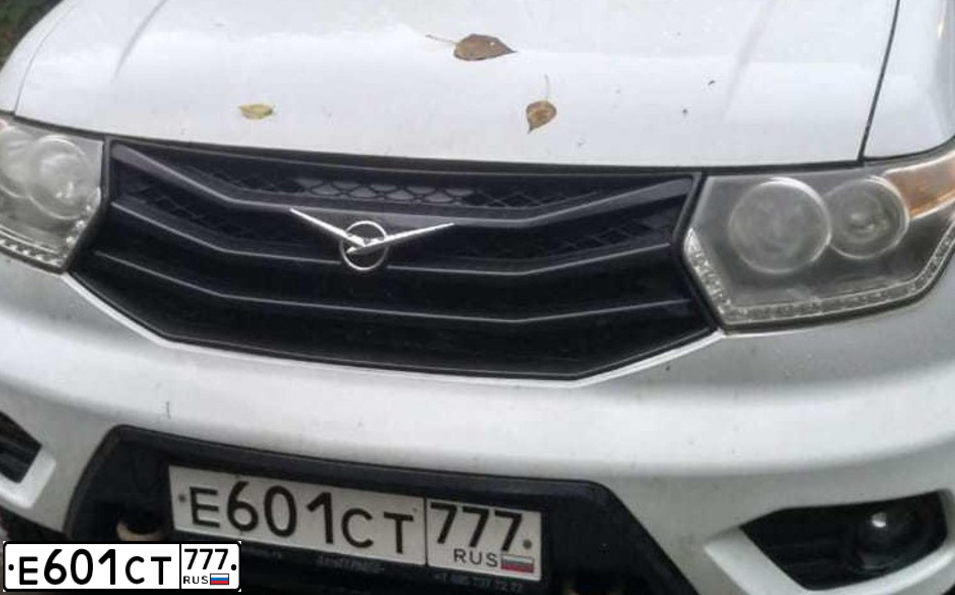 Фото автомобиля UAZ 3163 PATRIOT, 2016 — госномер Е601СТ777. Цвет: БЕЛАЯ
