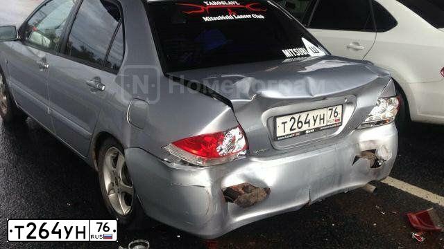 Фото автомобиля MITSUBISHI LANCER, 2005 — госномер К658КС76. Цвет: Серебристый