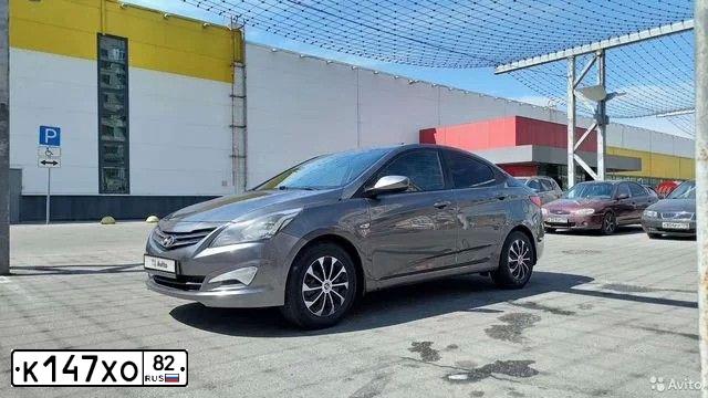 Фото автомобиля HYUNDAI SOLARIS, 2016 — госномер Р129АМ550. Цвет: ТЕМНО-СЕРЫЙ