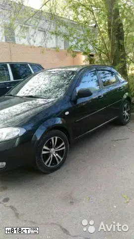 Фото автомобиля CHEVROLET LACETTI, 2009 — госномер Н121РТ82. Цвет: ЧЕРНЫЙ