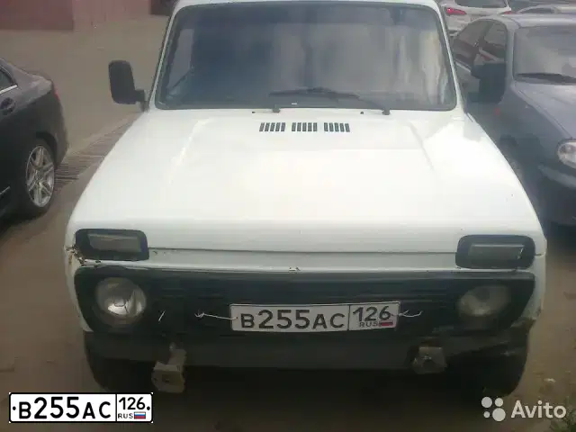 Фото автомобиля LADA 2121 NIVA, 1999 — госномер А026НТ126. Цвет: БЕЛЫЙ
