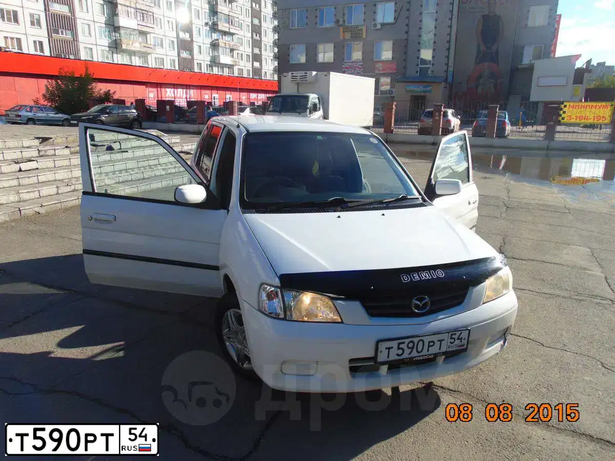 Фото автомобиля MAZDA DEMIO, 2001 — госномер К450НА154