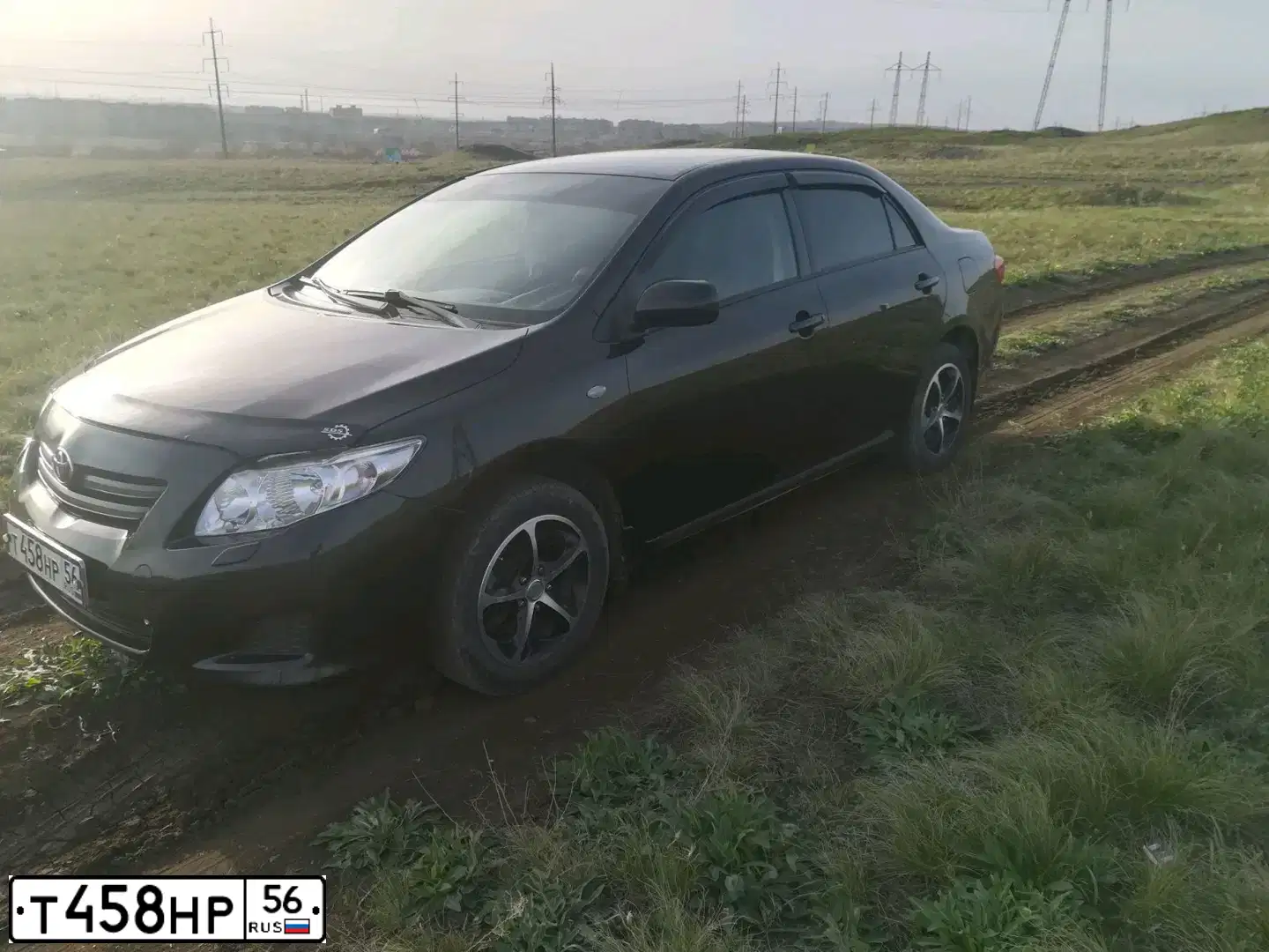 Фото автомобиля TOYOTA COROLLA, 2008 — госномер Е585СО156. Цвет: ЧЕРНЫЙ