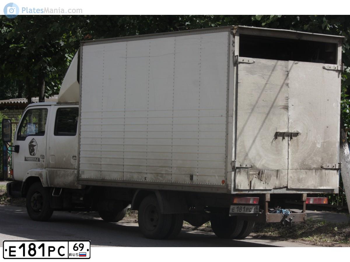 Фото автомобиля NISSAN CABSTAR, 2000 — госномер Е181РС69. Цвет: БЕЛЫЙ