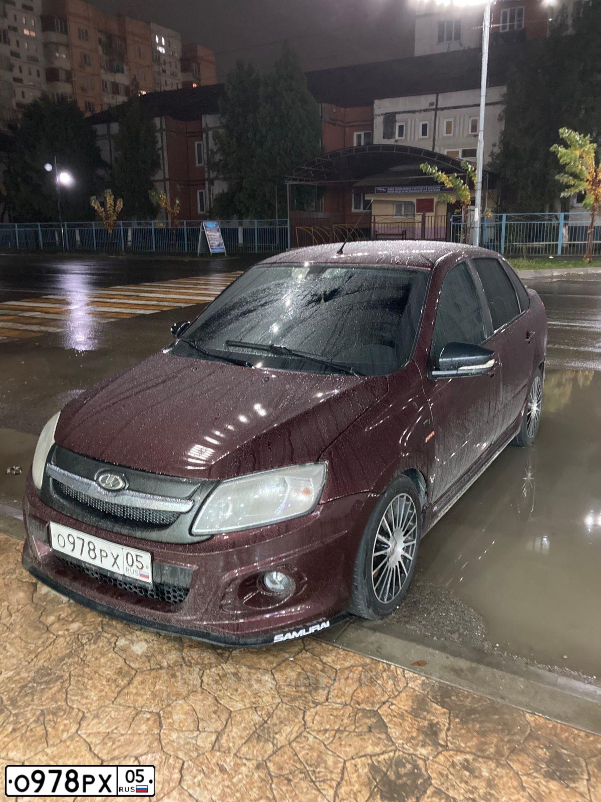 Фото автомобиля LADA 2190 GRANTA, 2015 — госномер О978РХ05. Цвет: ТЕМНО-ВИШНЕВЫЙ
