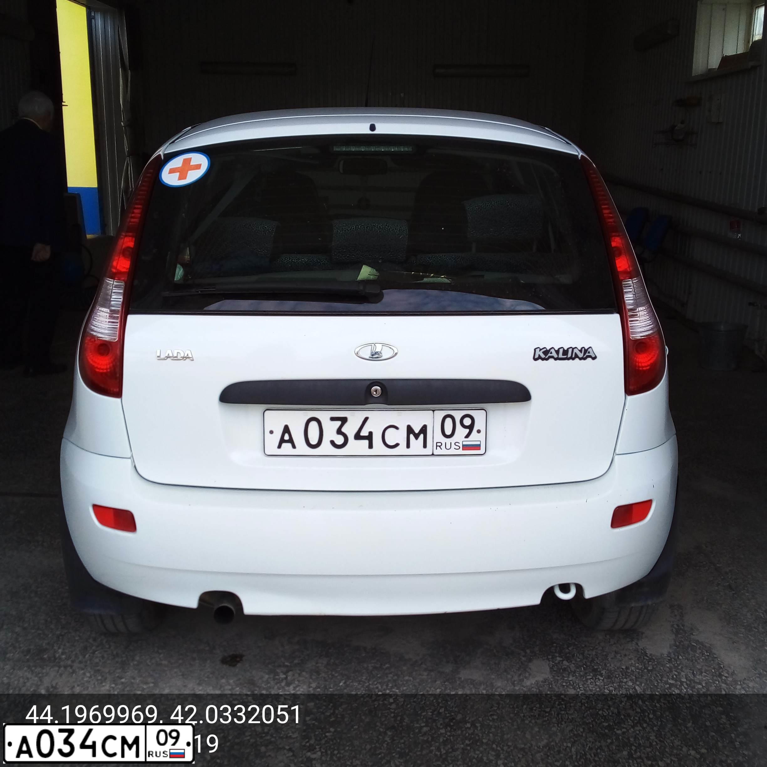 Фото автомобиля LADA 1119 KALINA, 2012 — госномер А034СМ09. Цвет: БЕЛЫЙ