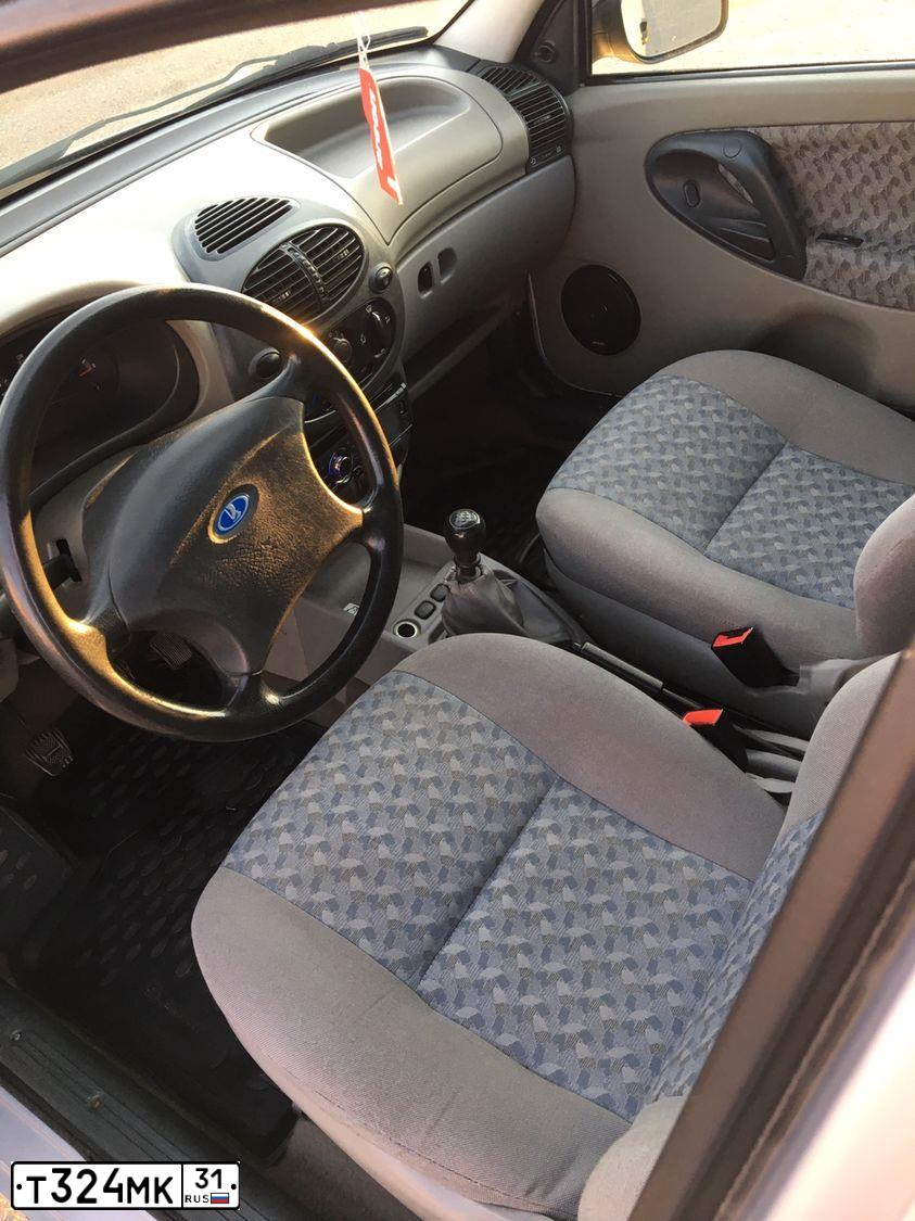 Фото автомобиля LADA 1119 KALINA, 2010 — госномер Т324МК31. Цвет: СЕРЕБРИСТЫЙ